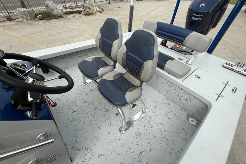 Slide: The Image of 2017 Blazer Bay 2420 boat interior with center console and spacious deck. - 10