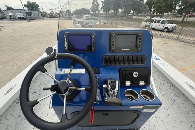 Slide: The Image of 2017 Blazer Bay 2420 boat interior with dual seats and steering wheel. - 11