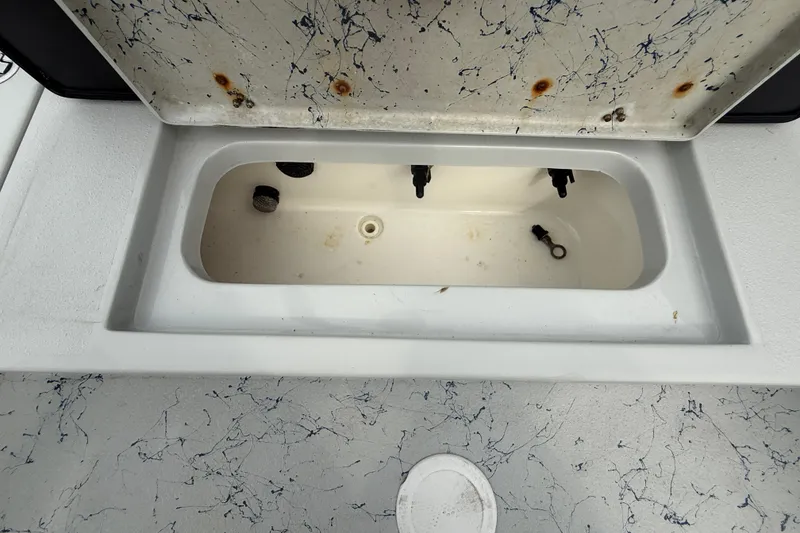 Slide: The Image of 2017 Blazer Bay 2420 boat interior with seating and storage compartments. - 13