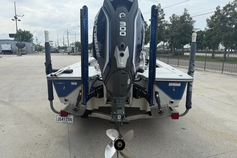 Slide: The Image of 2017 Blazer Bay 2420 boat with Evinrude engine on a trailer. - 5