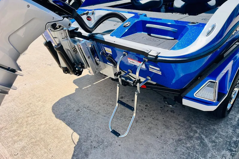 Slide: The Image of 2024 Ranger 620FS Pro boat rear view with motor and ladder. - 10