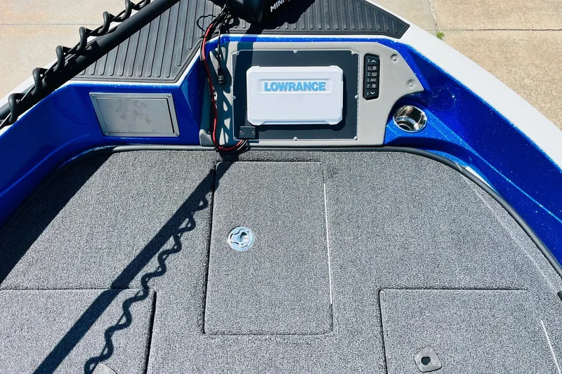 Slide: The Image of 2024 Ranger 620FS Pro boat deck with Lowrance electronics and carpeted surface. - 14