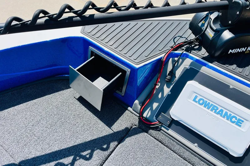 Slide: The Image of 2024 Ranger 620FS Pro boat interior with storage drawer and Lowrance electronics. - 16