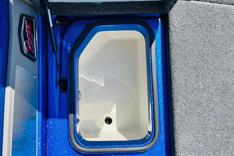 Slide: The Image of 2024 Ranger 620FS Pro boat compartment with blue trim and Ranger logo. - 19