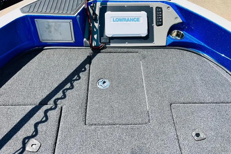 Slide: The Image of 2024 Ranger 620FS Pro boat deck with Lowrance electronics and carpeted surface. - 22