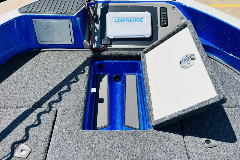 Slide: The Image of 2024 Ranger 620FS Pro boat deck with Lowrance electronics and open storage compartment. - 23