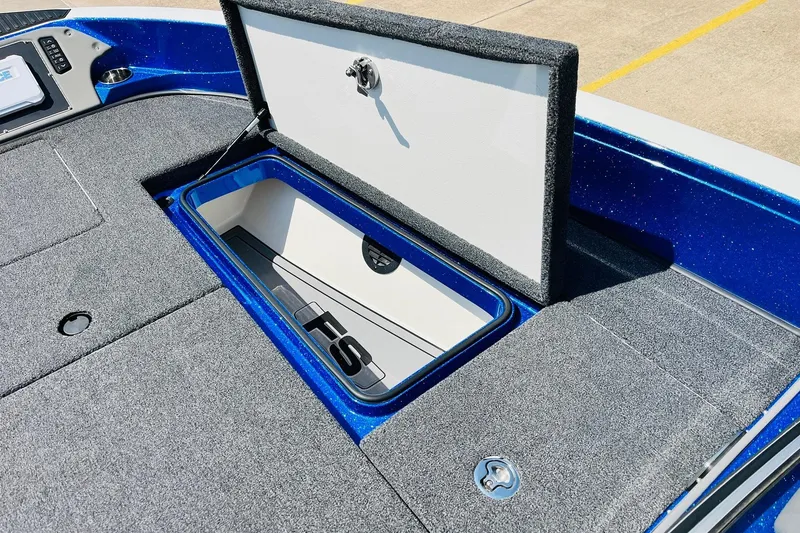 Slide: The Image of 2024 Ranger 620FS Pro boat storage compartment with open lid, showcasing interior design. - 27