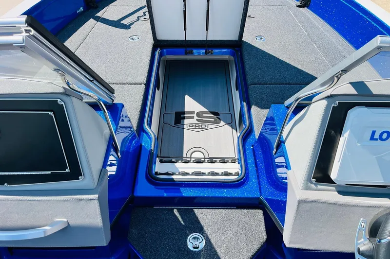 Slide: The Image of 2024 Ranger 620FS Pro boat interior with storage compartments and sleek design. - 30