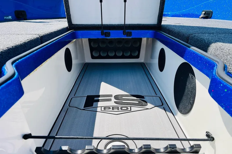 Slide: The Image of 2024 Ranger 620FS Pro boat storage compartment with blue accents and FS Pro logo. - 31