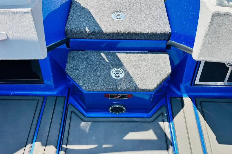 Slide: The Image of 2024 Ranger 620FS Pro boat interior with blue accents and storage compartments. - 32