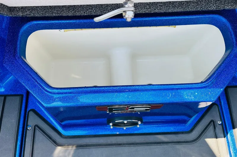 Slide: The Image of 2024 Ranger 620FS Pro boat compartment with blue interior detailing. - 33