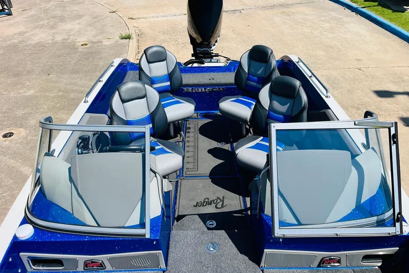 Slide: The Image of 2024 Ranger 620FS Pro boat interior with four seats and dual windshields. - 34
