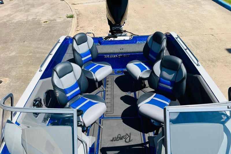 Slide: The Image of 2024 Ranger 620FS Pro boat interior with four blue and gray seats. - 35