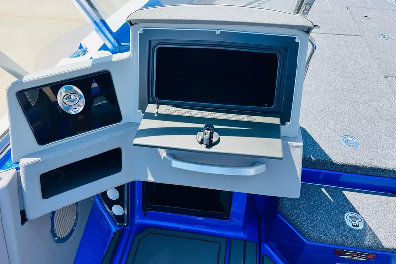 Slide: The Image of 2024 Ranger 620FS Pro boat dashboard with storage compartment and sleek design. - 43