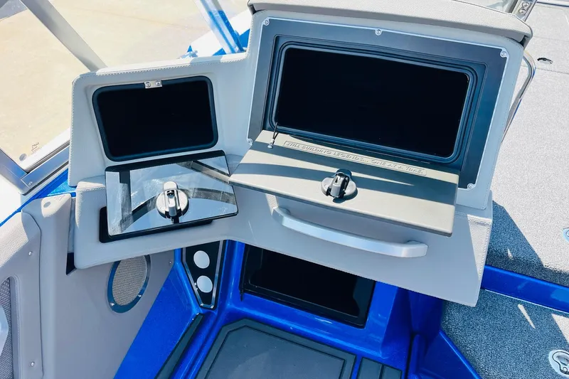 Slide: The Image of 2024 Ranger 620FS Pro boat dashboard with storage compartments and sleek design. - 45