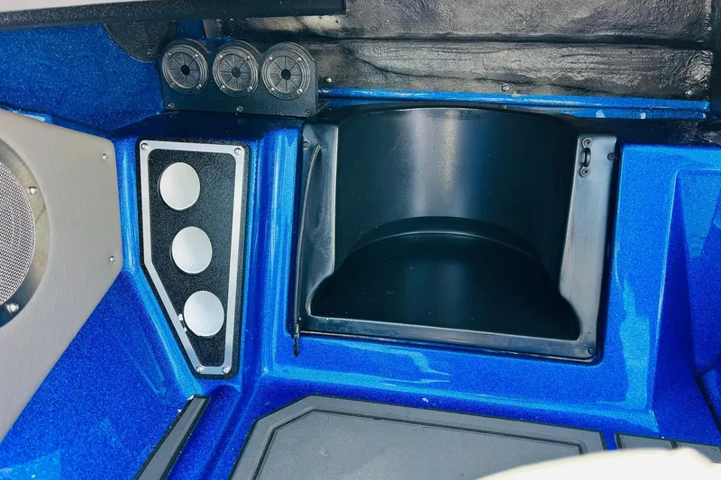 Slide: The Image of 2024 Ranger 620FS Pro boat interior with blue finish and speaker system. - 46