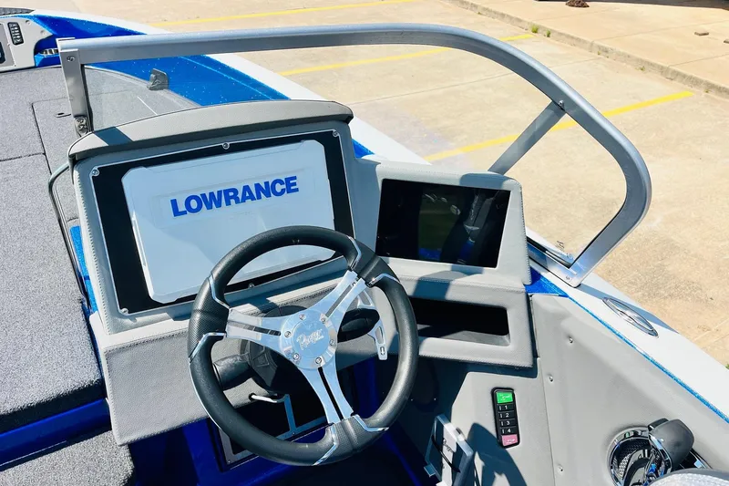 Slide: The Image of 2024 Ranger 620FS Pro boat dashboard with Lowrance display and steering wheel. - 47