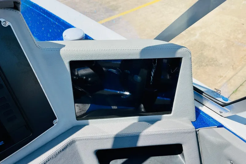 Slide: The Image of 2024 Ranger 620FS Pro dashboard with touchscreen display in a boat cockpit. - 49