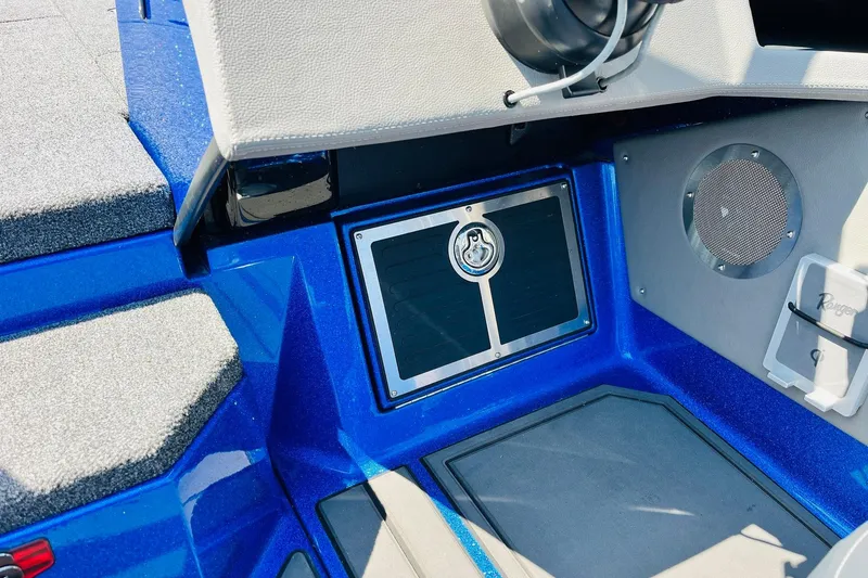 Slide: The Image of 2024 Ranger 620FS Pro boat interior with blue accents and speaker detail. - 50