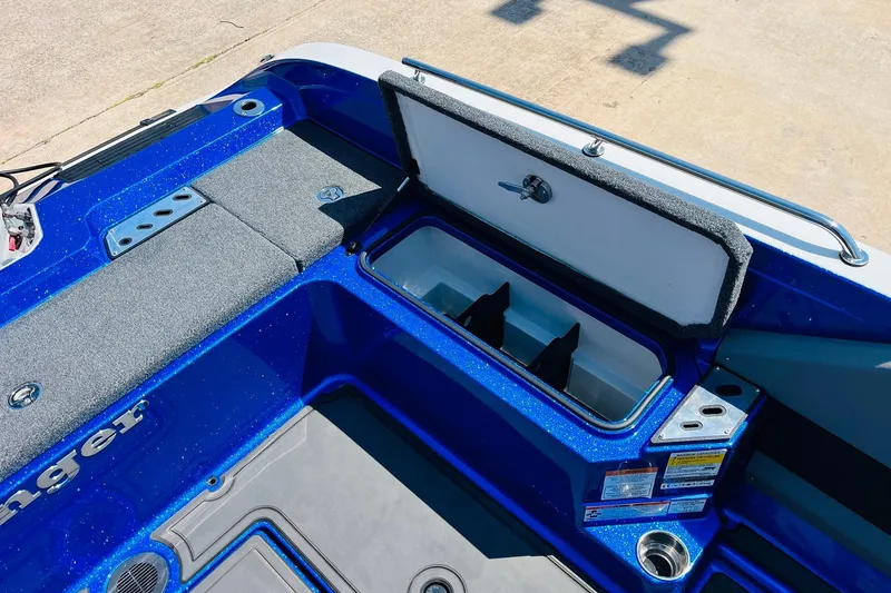 Slide: The Image of 2024 Ranger 620FS Pro boat interior with open storage compartment, blue finish. - 57