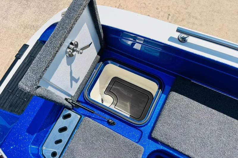 Slide: The Image of 2024 Ranger 620FS Pro boat storage compartment with open lid, showcasing interior design. - 60