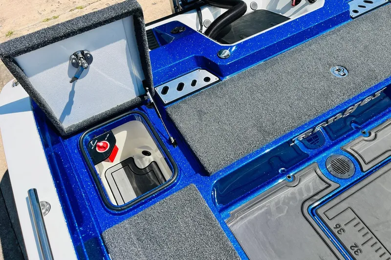 Slide: The Image of 2024 Ranger 620FS Pro boat deck with storage compartments and blue finish. - 63