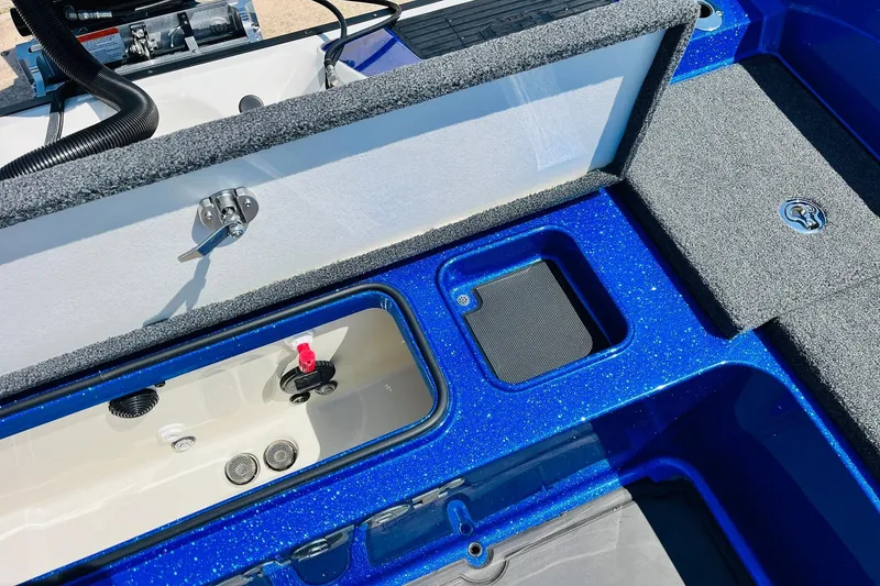 Slide: The Image of 2024 Ranger 620FS Pro boat interior storage compartments, featuring blue finish and utility access. - 67