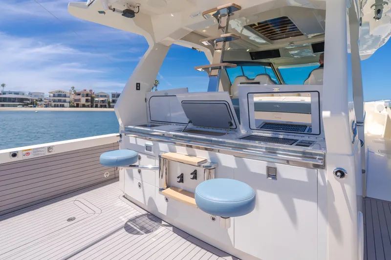 Slide: The Image of 2023 Scout 530 LXF luxury yacht interior with modern amenities and ocean view. - 10