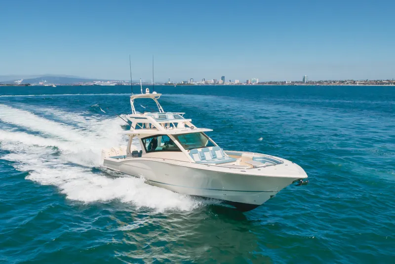 Slide: The Image of 2023 Scout 530 LXF luxury yacht cruising on open blue water. - 27