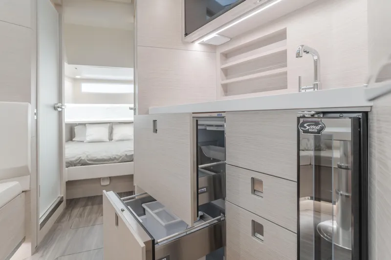 Slide: The Image of Luxurious interior of 2023 Scout 530 LXF yacht with modern kitchen and bedroom. - 6