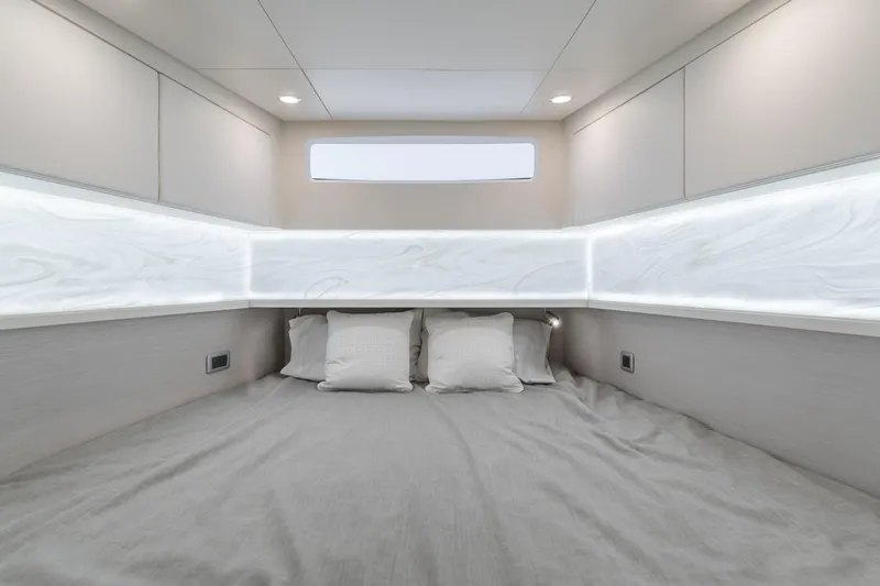 Slide: The Image of Luxurious cabin interior of 2023 Scout 530 LXF yacht with modern lighting and bedding. - 7