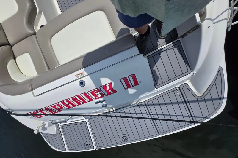 Slide: The Image of 2006 Sea Ray 270 Sundeck boat with custom name "Stephnick II" on deck. - 5