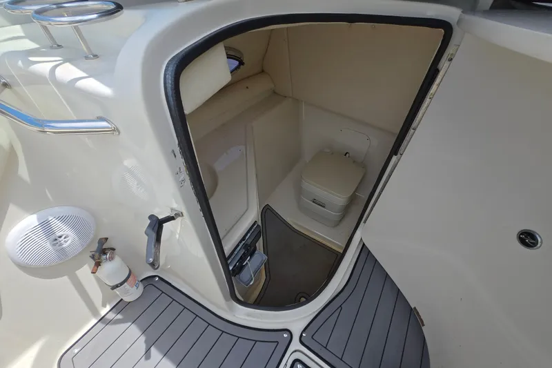 Slide: The Image of Interior view of 2006 Sea Ray 270 Sundeck boat's compact bathroom with toilet. - 6