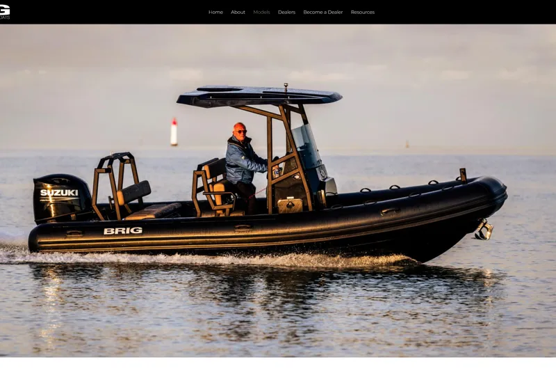 Slide: The Image of 2026 Brig Navigator 22 boat in a warehouse, featuring sleek design and modern equipment. - 1