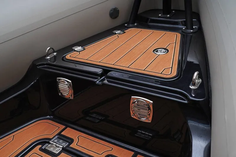 Slide: The Image of 2026 Brig Navigator 22 boat deck with sleek, modern design and secure storage compartments. - 11