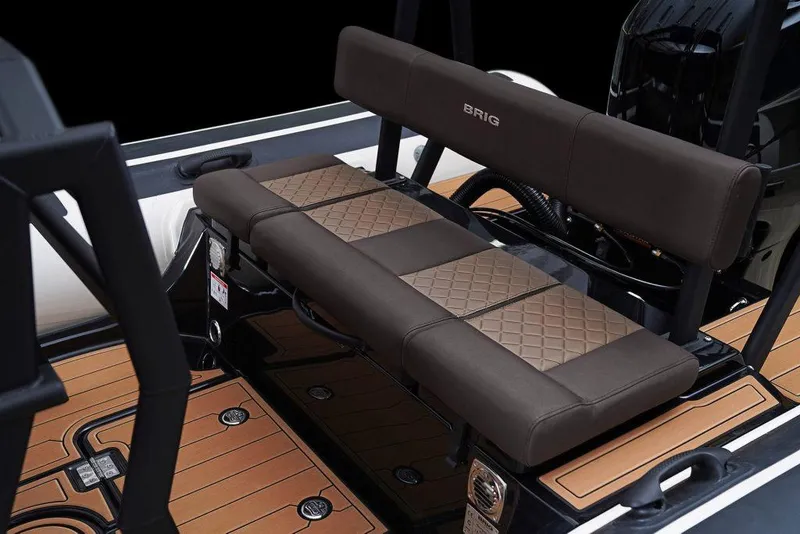 Slide: The Image of 2026 Brig Navigator 22 boat dashboard with advanced navigation system and steering wheel. - 7