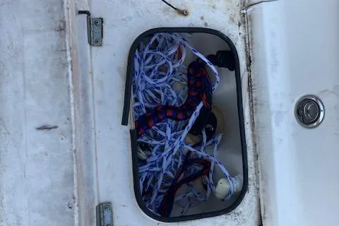 Slide: The Image of Storage compartment on 2007 Dutch Sterling 22 boat with ropes and equipment. - 12