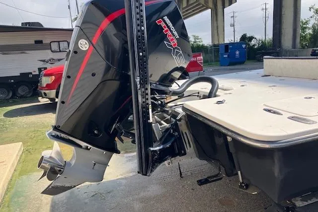 Slide: The Image of Outboard motor on a 2007 Dutch Sterling 22 boat, parked under a bridge. - 2