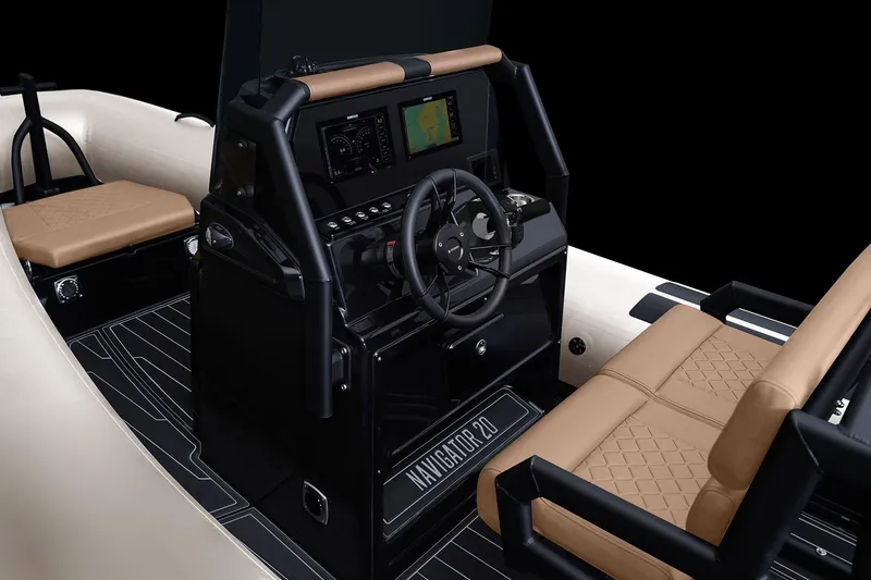Slide: The Image of 2026 Brig Navigator 20 boat interior with modern dashboard and tan seating. - 3