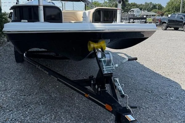 Slide: The Image of 2026 Hurricane FD198RE-OB boat on trailer, parked on gravel lot. - 4
