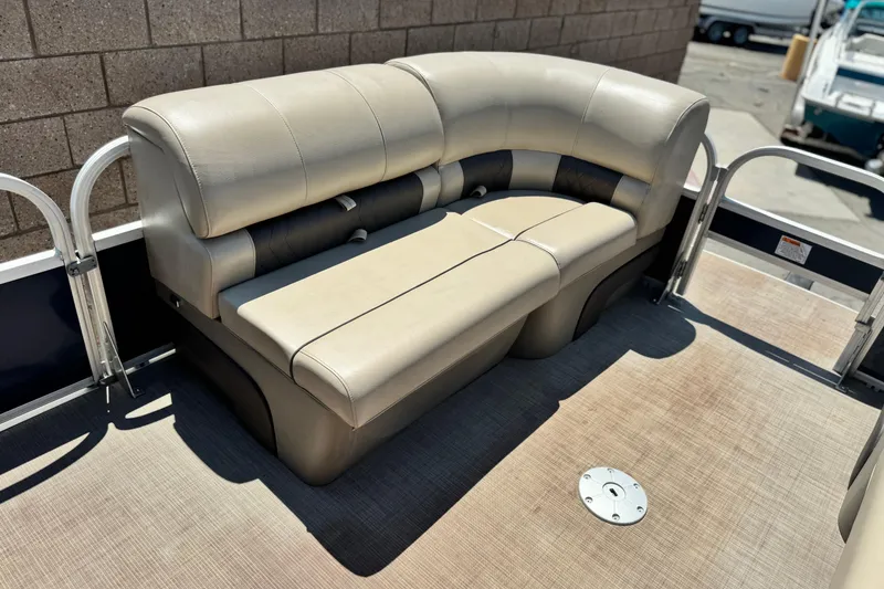Slide: The Image of 2021 Sun Tracker SportFish 22 DLX boat seating area with beige upholstery. - 11