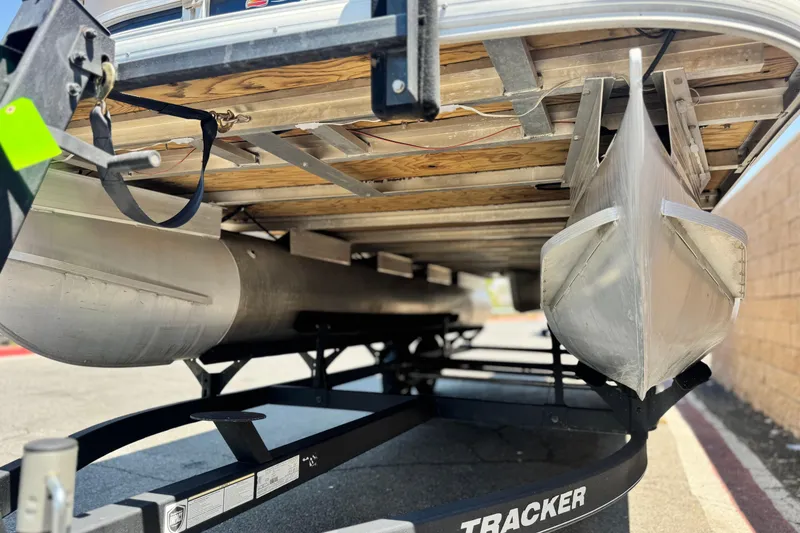 Slide: The Image of Underneath view of a 2021 Sun Tracker SportFish 22 DLX pontoon boat on a trailer. - 4