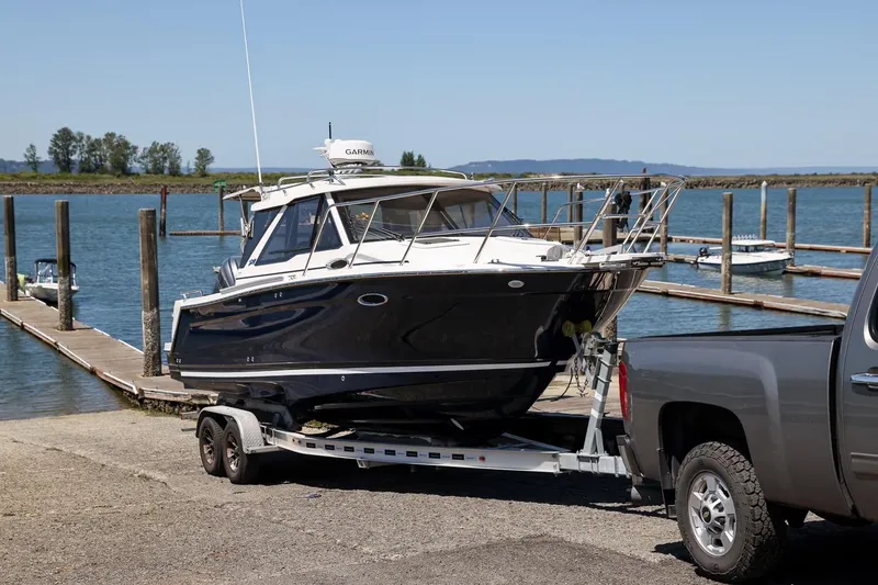 The Image of 2026 Cutwater C-248 Coupe on trailer by dock, ready for launch. - 0