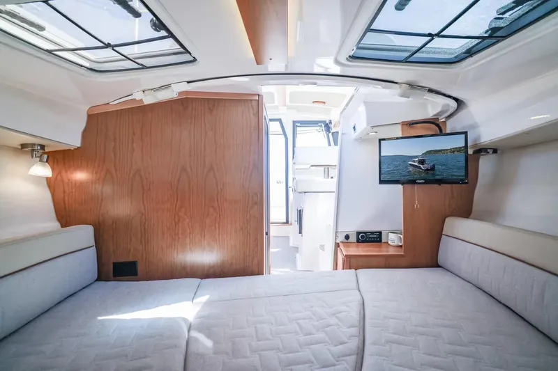 Slide: The Image of Interior of 2026 Cutwater C-248 Coupe with cozy seating and mounted TV. - 11