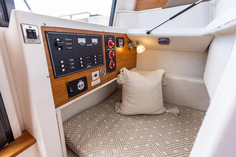 Slide: The Image of Cozy interior of 2026 Cutwater C-248 Coupe with control panel and cushion. - 14