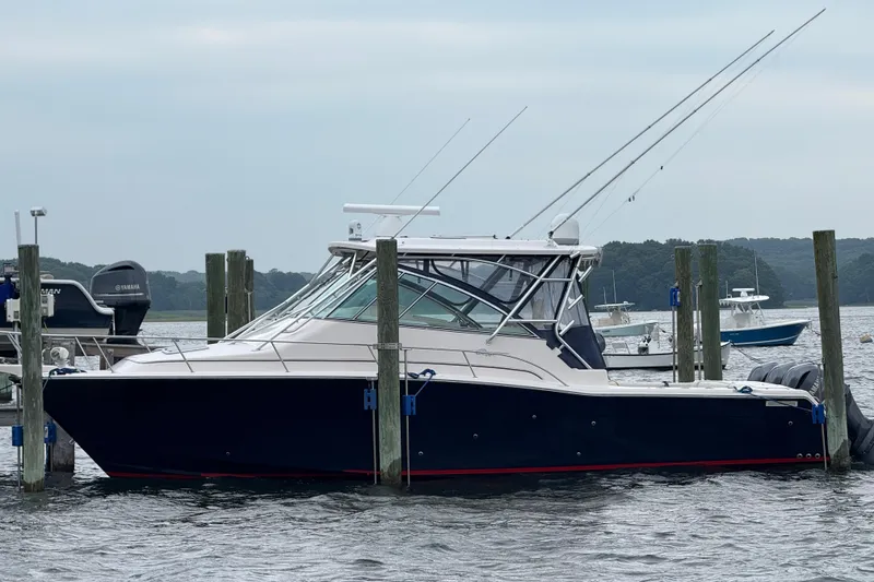 Slide: The Image of 2008 Grady-White Express 360 boat docked in a marina, side view. - 15