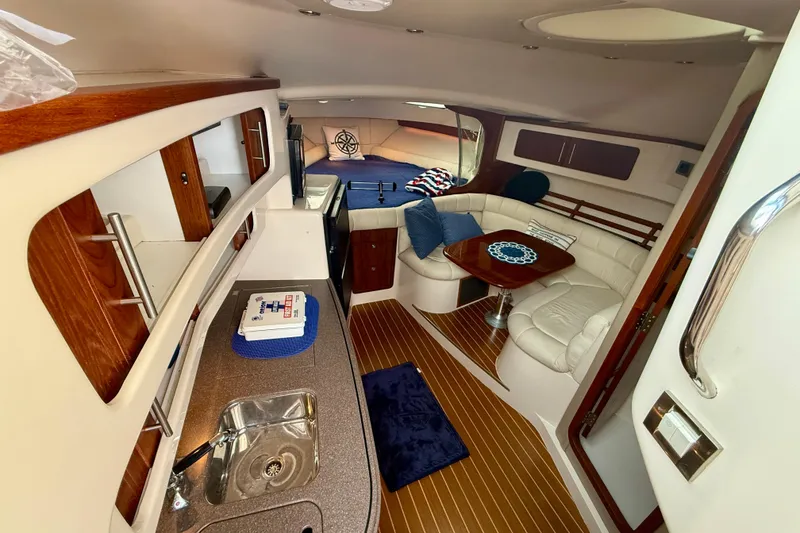Slide: The Image of Luxurious 2008 Grady-White Express 360 cabin interior with kitchenette and seating area. - 8