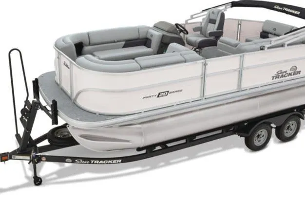 Slide: The Image of 2026 Sun Tracker Party Barge 20 DLX pontoon boat on trailer, side view. - 11