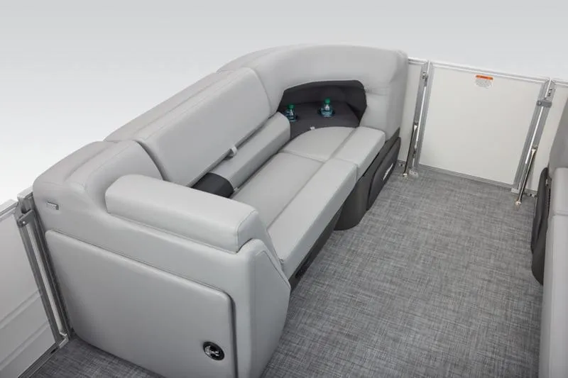Slide: The Image of 2026 Sun Tracker Party Barge 20 DLX interior with gray seating and cup holders. - 24