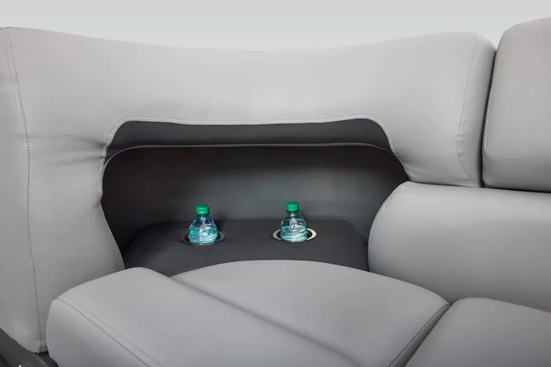 Slide: The Image of 2026 Sun Tracker Party Barge 20 DLX interior with cup holders and water bottles. - 28